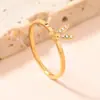Anillo Transfronterizo Nuevo de Acero Inoxidable para Mujer Estilo Frío Dorado Simple Lujo Ligero Diamante Micro 1.5mm Anillo de Acero de Titanio Fábrica
