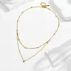 Collar de doble capa con un solo diamante europeo y americano transfronterizo, con cuentas doradas, acero de titanio chapado al vacío en color, modelo nuevo que conserva el color