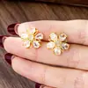 Nuevos Pendientes de Flor de Circonita de Moda Versátiles Oro de Arena Vietnamita Estilo de Lujo Ligero Pendientes Pequeños de Flor para Mujer Joyería Transfronteriza Venta Directa