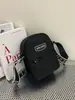Jielanshi 2026 Primavera Nova Bolsa Esportiva com Bloqueio de Cores em Tecido Impermeável Bolsa de Ombro Unissex Bolsa Transversal Bolsa para Celular Versátil