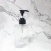 Botella de loción con boca de tornillo rayada 180ml Botella con cabeza de bomba de presión Botella de vidrio Botella de loción vacía transparente