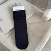 Calcetines de maternidad versátiles sin costuras de principios de otoño, calcetines casuales de algodón hasta la pantorrilla con efecto holgado, calcetines largos de color liso estilo ins para niñas en tonos café