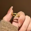 Anillo Popular de Osmanthus Pequeño Estilo Rico de Xiaohongshu 2026 Nuevo Modelo, Nuevo Anillo de Flor de Oro Pequeña de Lujo Ligero Estilo Chino, Venta al por Mayor de una Pieza