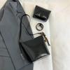 Bolso de hombro tipo cubo vintage de estilo coreano para mujer, estilo nicho, para otoño e invierno de 2024. Bolso bandolera de hombro a juego.