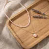 Collar con colgante de perla de doble capa de acero inoxidable, chapado en oro al vacío, venta al por mayor desde una fábrica de joyería de nicho para exportación
