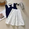 Falda midi caqui estilo universitario 2026 nuevo diseño de primavera falda midi de bolsillo estilo japonés que reduce la edad falda de línea A versión coreana