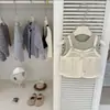 Nuevo conjunto de dos piezas de otoño para niñas, a la moda y con estilo, estilo coreano: chaleco de dos piezas falso con corbata de moño y pantalones acampanados de encaje
