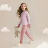 Otoño/Invierno 2026 Conjunto de Pijama de Color Sólido con Cuello Redondo para Niños y Niñas Ropa de Casa Conjunto de Ropa Interior Térmica Suave para Niños