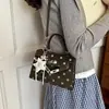 Bolso Kelly nuevo y versátil para mujer 2026, lujo ligero, moderno, de nicho, cuadrado pequeño, para ir al trabajo, bolso de mano de lunares