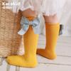 Calcetines de otoño e invierno para niños con lazo de color sólido rojo año nuevo calcetines de tubo calcetines de algodón de viento de princesa para niñas calcetines de baile al por mayor