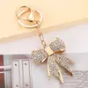 Chaveiro Fofo de Coração Feminino com Laço de Diamante Pingente de Bolsa Simples e Moderno Anel de Chaveiro de Carro Pequeno Presente