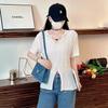 V-Neck Chain pendurado suéter de manga curta mulheres verão novo estilo preguiçoso estilo irregular split sexy oco top