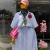 Ropa Femenina Transfronteriza Europea y Americana 2026 Verano Nueva Moda Conjunto de Camisa Azul a Rayas Holgada y Falda con Cintura de Corbata
