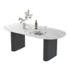 Mesa de comedor de color crema, moderna y lujosa con tapa de piedra para uso doméstico, con un diseño moderno y minimalista de forma ovalada negra, adecuada para comedores