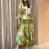 Colección de otoño 2026 para mujer europea y americana transfronteriza: vestido largo estampado con cuello, mangas de farol y detalles de botones y cintas