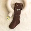 Novas Leggings de Listras Verticais Brilhantes com Pingente de Laço Fofo para Meninas Estilo Coreano Meia-Calça Antiderrapante Venda por Atacado