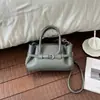 Bolsa de mão com padrão de lichia, bolsa transversal simples e estilosa, novo modelo outono 2026, design retrô de nicho, bolsa de ombro para o dia a dia