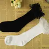 Versión coreana de las nuevas medias de encaje de color liso para niños Primavera y Otoño Invierno algodón peinado para bebé Calcetines Altos Calcetines al por mayor