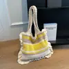 Coleção de outono 2026 transfronteiriça nova: Bolsa de ombro feminina casual, versátil e leve com design tramado apresentando listras contrastantes, perfeita para o dia a dia