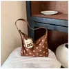 Bolso de mujer de gran capacidad 2026 nuevo bolso de moda casual para principios de otoño para la escuela y el trabajo, bolso tipo albóndiga de hombro y cruzado