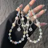 Elegante correa de cristal con cuentas para teléfono con colgante de girasol de circonita, cordón para teléfono, accesorio para muñeca y bolso, anti-pérdida
