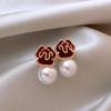 Pendientes de botón con perlas y flores de Año Nuevo, elegantes, de alta calidad, con un diseño de nicho y personalidad que combina con todo.