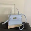 Otoño/Invierno 2026 Nuevo Elegante Textura de Moda Versátil Ligero de Lujo con Relieve de Cocodrilo Bolso Kelly de Hombro Cruzado de Mano