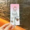 Lindo chaveiro de pingente de bolsa estilo miu DIY pequeno pingente fone de ouvido coração laço pequenos acessórios atacado