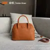 Bolso de mano para mujer, primavera y verano 2023, de piel auténtica, sencillo, moderno, informal, retro, portátil.
