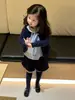 Ropa Infantil Estilo Coreano Nueva Otoño 2026: Chaqueta Camisa de Cuello de Muñeca a Cuadros Bordada Cárdigan Pantalones Cortos de Pana para Niñas