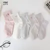 Calcetines para niñas Yishuangshuang, nuevos calcetines de otoño e invierno con forma de corazón de dibujos animados hasta la mitad de la pantorrilla, algodón peinado, calcetines estilo Miu con letras y caras sonrientes para estudiantes