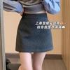 Artículo Popular de Alta Calidad de las Trece Líneas de Guangzhou ~ Falda de Lana para Mujer para Otoño e Invierno, Moderna, Cómoda, Falda Corta Lápiz de Corte A Anti-Exposición