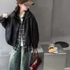Chaqueta de cuero para niña prenda de abrigo de otoño 2026 nuevo estilo primavera y otoño para niñas mayores moderna casual corte holgado estilo callejero chaqueta de cuero para niños