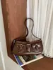 Bolso de hombro retro de alta gama para chica popular transfronterizo, bolso de hombro de moda estilo motociclista, bolso cruzado versátil para el día a día