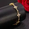 Bestseller Douyin Exclusiva Pulseira de Trevo de Quatro Folhas Feminina Design de Nicho Ins Luxo Leve Alta Qualidade Zircônia Estrelada Anel de Mão Joia