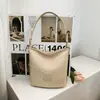 Bolso de axila tejido de nicho transfronterizo para mujer, nuevo estilo 2026, bolso de mano de moda, bolso tejido de paja, bolso versátil de un solo hombro cruzado