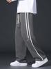 Pantalones casuales de estilo americano para hombre, pantalones holgados de pierna recta y ancha, pantalones deportivos de marca de moda con costuras a rayas para otoño.