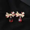 Pendientes de Tachuela de Circonita con Lazo Multicolor Temperamento Elegante de Gama Alta Azúcar Cubo Circonita Pendientes Coloridos de Comercio Exterior