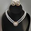 Corea del Sur Vintage Perla Diamante Borla Cadena de Cuello Celebridad Cibernética Sentido del Diseño Elegante Flor Lazo Cadena Clavicular Collar para Mujer