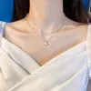 Collar con colgante de perlas de doble capa minimalista para mujer, versátil y elegante, con un aire de moda de alta gama, cadena para la clavícula de diseño único