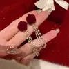 Brincos de Borla com Laço Vermelho 2026 Novo Estilo Quente Luxo Leve High-End Brincos de Ano Novo Acessórios de Orelha Únicos de Nicho