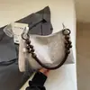 Bolsa de Mão Pequena Versátil de Alta Qualidade Transfronteiriça para Mulheres, Novo Estilo Primavera 2026 Bolsa de Ombro/Axila, Bolsa Tote Popular