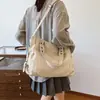 Bolsa de comércio exterior feminina 2026 outono novo versão coreana bolsa de mão de grande capacidade bolsa de ombro transversal casual simples