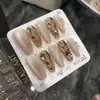 Uñas Postizas Cortas Doradas Florales Estilo Francés Cat-Eye Desmontables 2026 Producto Terminado de Uñas Artísticas de Alta Gama