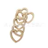 Decoración festiva de boda directa de fábrica anillo de corazón de melocotón colgante hueco de madera amor accesorios de moda hechos a mano