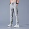 Calças de seda de gelo para homens verão novo Black Label Thin Business Casual Pants elástico respirável em linha reta tamanho grande calças esportivas