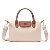 Bolso de mujer simple y versátil, nuevo modelo de verano 2026, multicompartimento, estilo coreano, moderno, único, bolso de hombro y cruzado casual