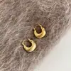 Brincos de design nicho estilo europeu e americano, metal oco, gota d'água, simples, estilo frio, sensação de alta qualidade, moderno, temperamento, tarraxa de orelha, feminino