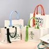 Bolsas de lona personalizadas transfronterizas con un toque de alta gama, bolsas de regalo navideñas, bolsas de lona promocionales para empresas