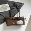 Bolso de hombro versátil de gran capacidad 2026 moda para mujer de trabajo bolso de axila otoño e invierno retro simple transfronterizo nuevo modelo